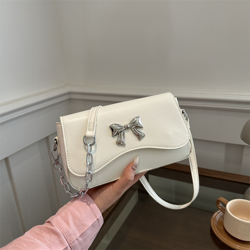 Este año popular bolso de arco para mujeres 2024 nuevo estilo extranjero primavera y verano mini bolso de cadena bolso de mochila