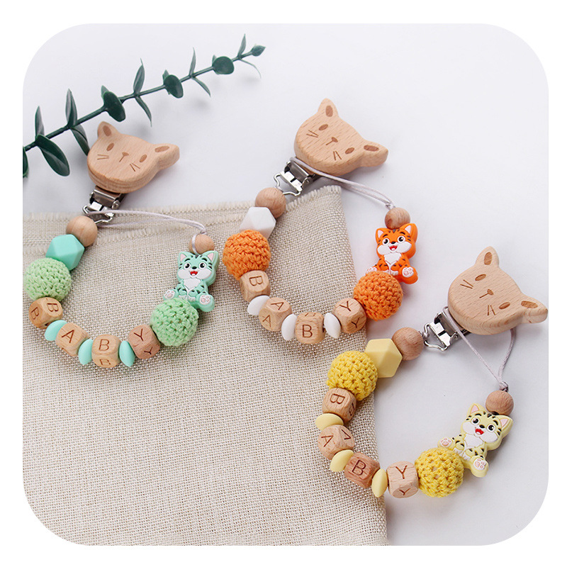 Nuevo bebé gato clip de chupeta de madera de haya dibujos animados juguetes de silicona para gatos calmar bebés chupeta cadena anti-caída cadena