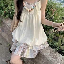 设计感小众拼接吊带连衣裙女夏季海边度假风温柔甜美花苞裙短裙子