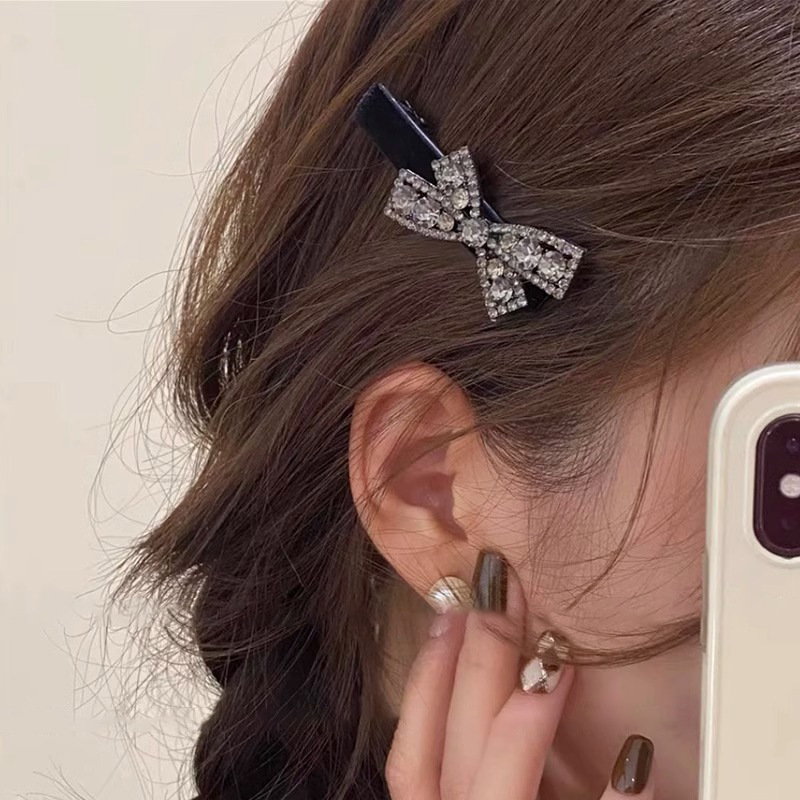 Clips de pelo de corbata de diamante ligero lujoso viento versátil arco de diamante clip de boca de pato de seda de mar clips de borde simple adornamiento para el pelo