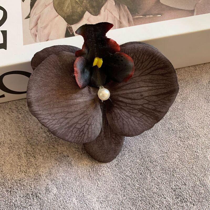 絹布の胡蝶蘭の花の頭は花の壁の部品の花の材料の頭をシミュレーションして髪を飾ってdiyの手作りの結婚祝いの贈り物を挟んで造花を飾ります。|undefined