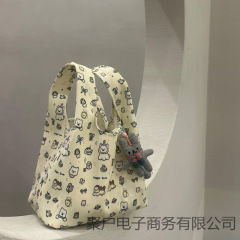手腕手提包新款大容量印花环保便当包卡通2025小狗帆布便携通勤包
