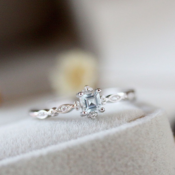 Yunjin transfronterizo nuevo pequeño anillo elegante fresco europeo y americano nicho diamante incrustado Topacio mar azul circón anillo