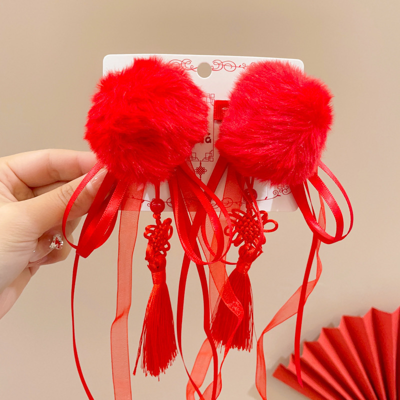 3 bolas de pelo rojo China con flecos
