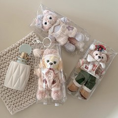 子供の包みのペンダントの保護カバーの防塵袋の透明な子供の包みの人形の星の黛露玲娜の貝の鍵は綿の子を掛けます。