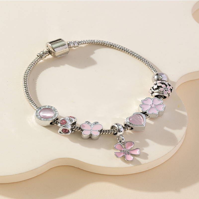 Panjia pulsera Dora DIY cuentas explosivas transfronterizas colgante pétalos de goteo de aceite ajustable flor amor pulsera de cobre