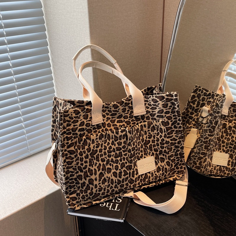 Leopardo tela bolsa de tela para mujeres bolsa de gran capacidad 2024 nuevo estilo relajado sensación de mano viaje bolsa de hombro de mamá