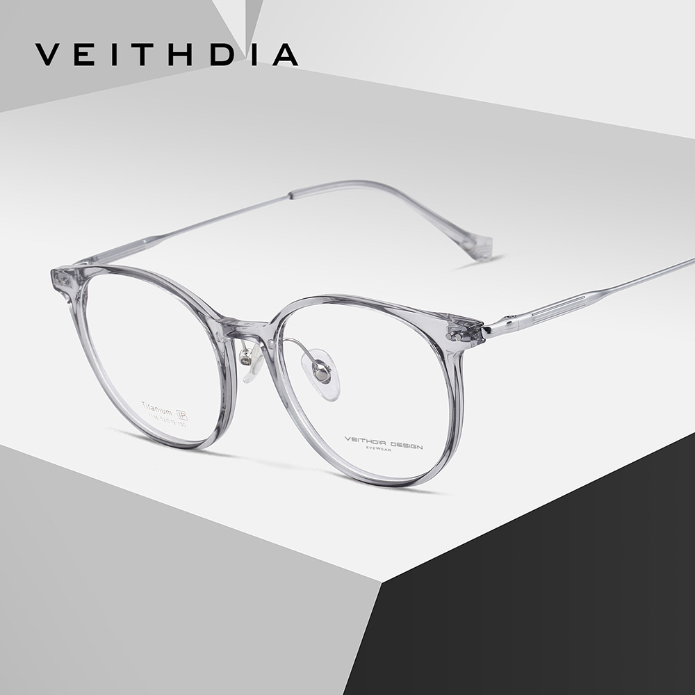 Marco de lente de miopía óptica de pie de titanio puro y ligero El marco de ojo masculino y femenino puede estar equipado con stock de transmisión en vivo 7136
