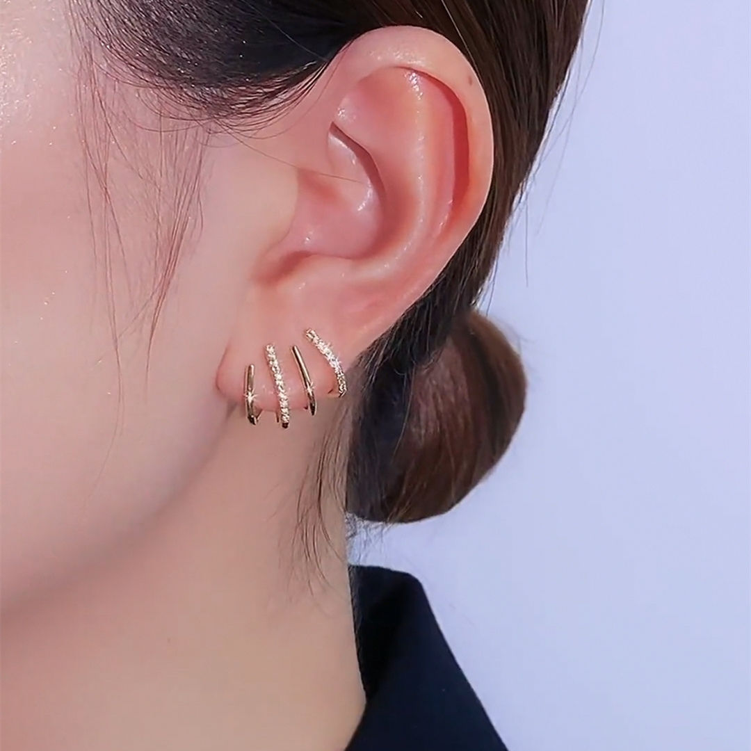 One ear piercing brings out the effect of four earrings
