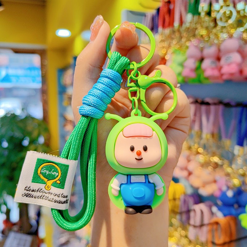 lindos dibujos animados luciérnagos llavero rojo estereoscópico muñeca de goma suave colgante de alto valor de la cara brillante pareja colgante