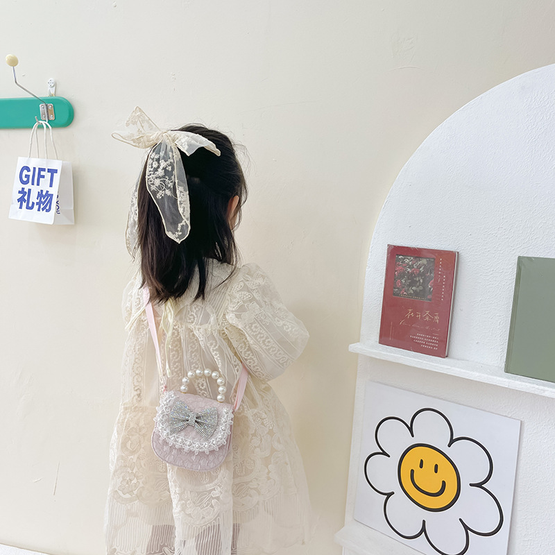Bolsa de Niños de estilo coreano lindo arco perla Bolso pequeño princesa estilo occidental desgaste a juego joyería bolsa crossbody bolsa