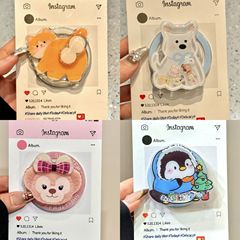 かわいい漫画のロッキングktは、マグセーフのマグネットスタンドの携帯電話のケースを適用して、伸縮性のある新しいエアバッグを吸着します