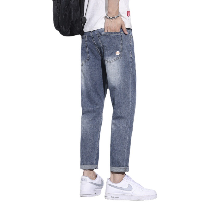 Pantalones vaqueros blancos lavados vintage de la estación europea de los hombres nuevos pantalones largos de los hombres elásticos flojos de moda del todo-fósforo