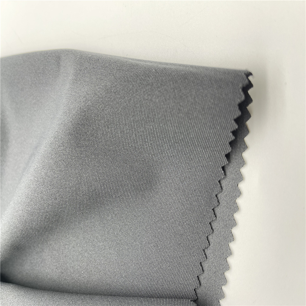 销售 全涤弹丝布 微弹 硬挺裤子面料 经编平布