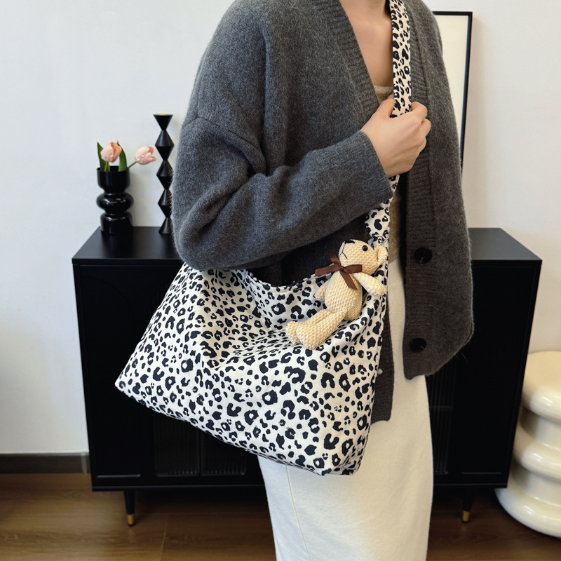 Estudiantes universitarios clase de viaje bolsa de gran capacidad para mujeres 2024 nueva moda extranjera leopardo tela mochila