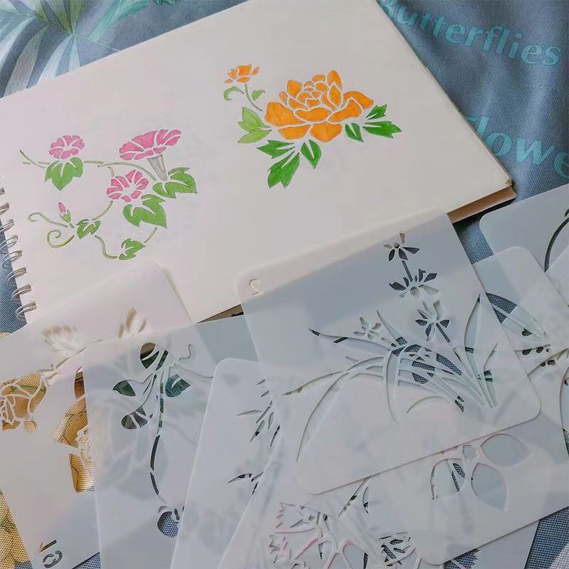 子供の透かし彫りの絵画のテンプレートの絵画の道具diyのアルバムのレースの定規の手の帳簿の小学生の手は神器を書き写します。|undefined