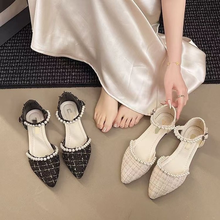 Baotou sandalias para mujeres 2026 nuevo verano en línea Fairy estilo de perla francesa punta plana con falda zapatos individuales
