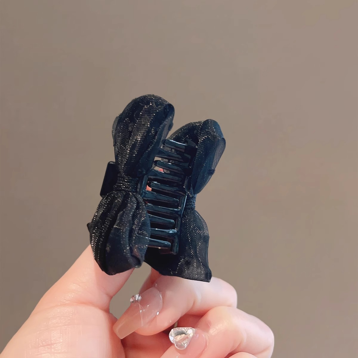 Black double-sided crab pin with bow