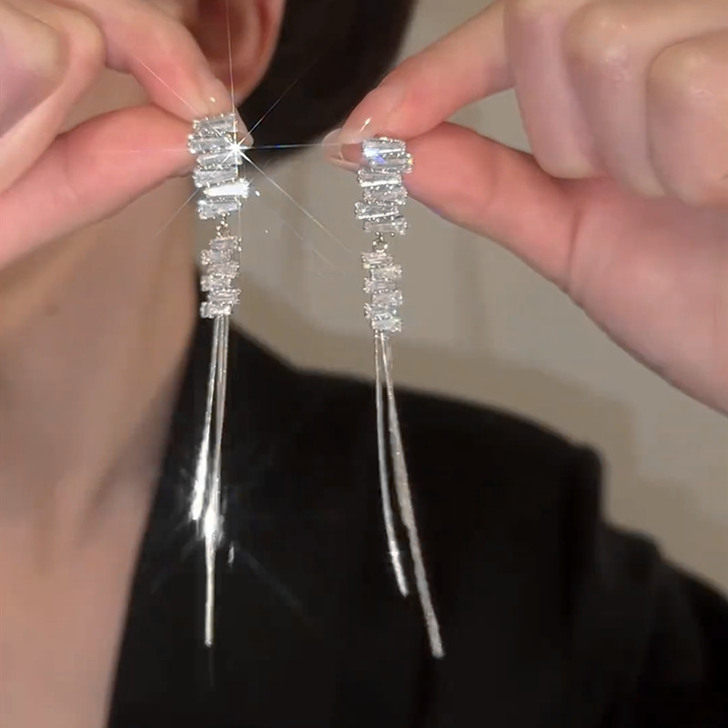 Elegant fashionable earrings with zircon with tassels