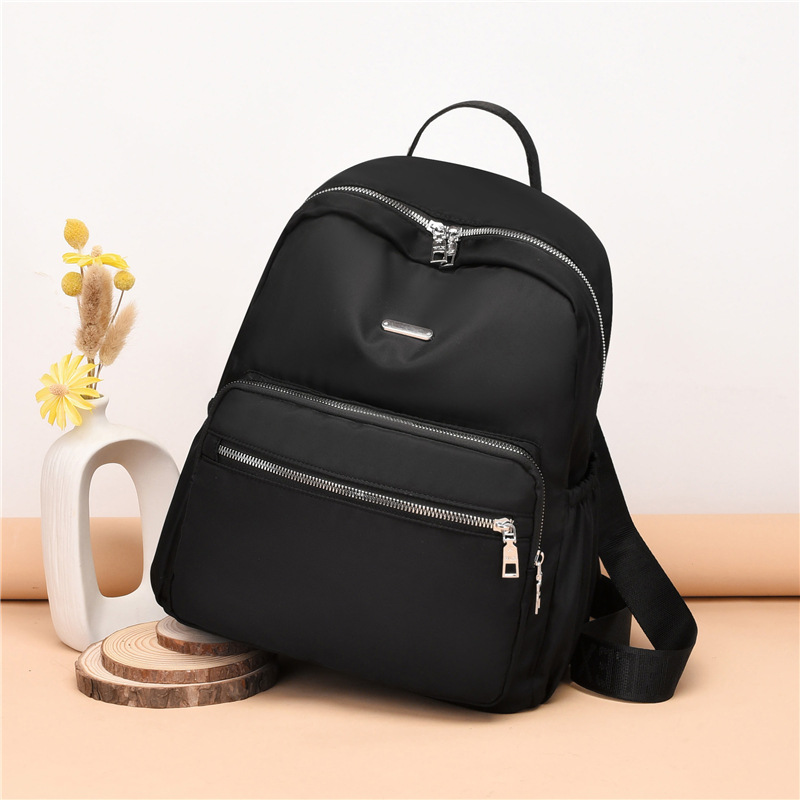 Mochila de las mujeres de moda casual de nylon de tela Oxford verano nuevo personalizado todo fósforo bolsa mochila de las mujeres Generación de pelo