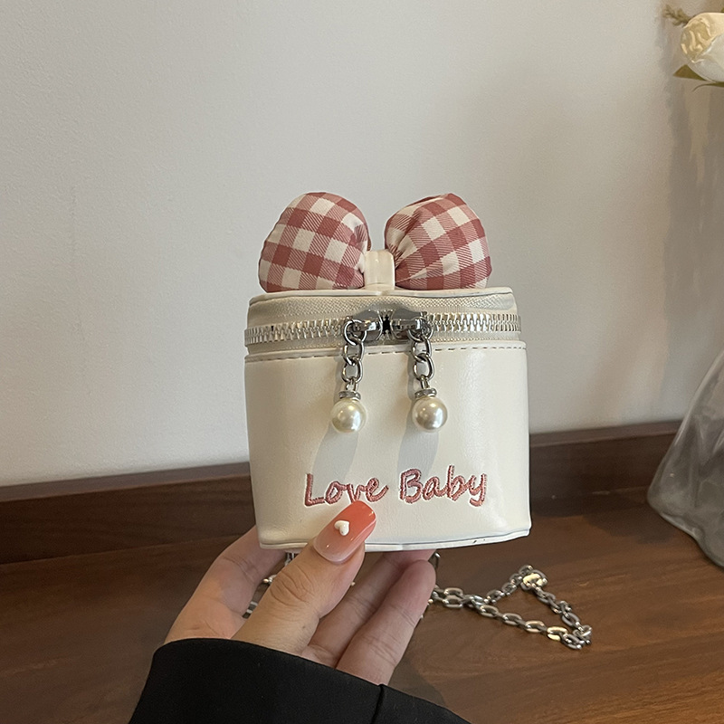 Bolso de cubo de moda coreana 2025 verano nuevo bolso femenino lindo lazo bolso de hombro mini cadena bolso de mensajero