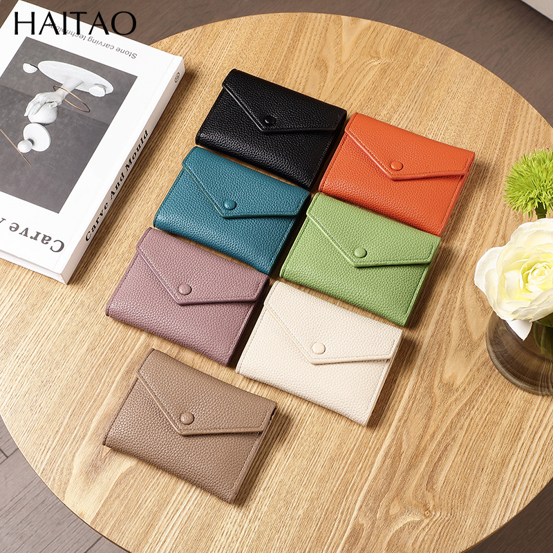 Cartera de mujer corta simple cartera plegable de tres pliegues japonesa y coreana de moda nuevo sobre bolso de cambio transfronterizo