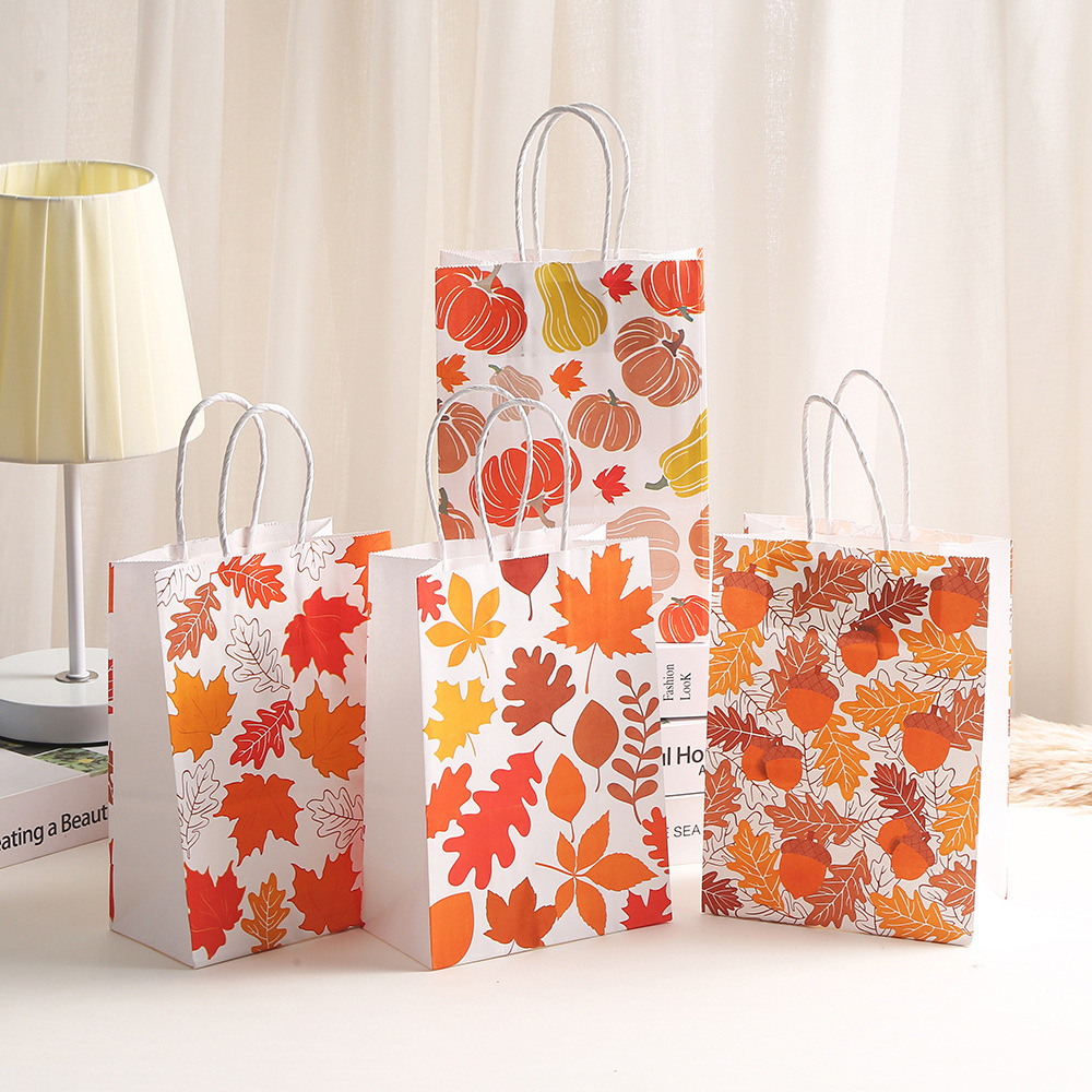牛皮纸纸袋子枫叶印花手提袋商场购物包装袋派对糖果礼品袋子批发