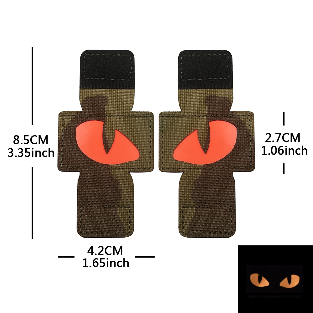 Creativo suministro personalizado gato ojo luminoso moral sello al aire libre militar fan mochila sello pequeño diablo militar MOLLE colgante