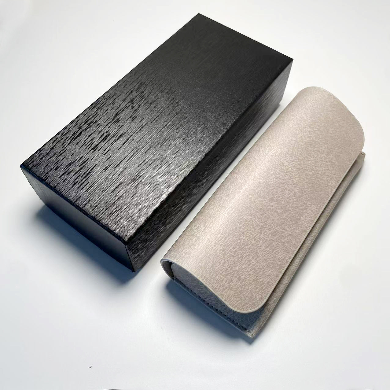 Caja de gafas de alta sensibilidad personalizada paquete de gafas corticales anti-compresión caja de gafas de sol portátil de absorción magnética caja de gafas de sol caja de almacenamiento