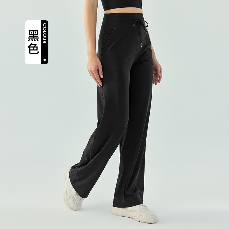 裸感の高い腰のひもの運動のズボンの女性のゆったりしている広脚の純色のフィットネスのズボンのランニングはスリムに見えます。