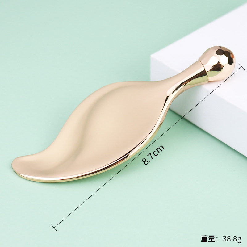 Crema de ojos en forma de hoja dorada