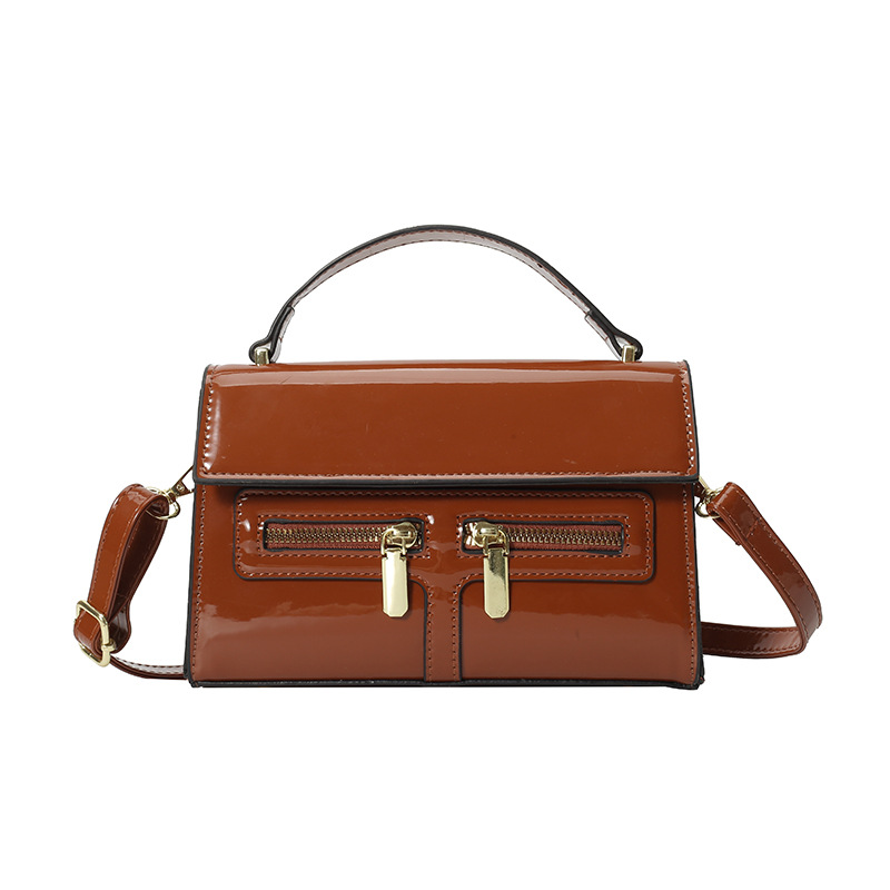 Bolso de diseño de nicho 2025 verano nuevo bolso femenino de alta calidad textura bolso de hombro charol brillante bolso de mensajero marea