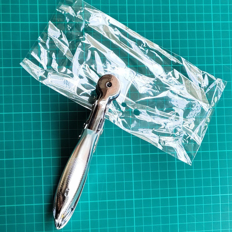 Bolsa de plástico transparente de tela, caja de almacenamiento, bolsa de plástico, embalaje, pinza para perforar, máquina perforadora de tela de película, perforadora, perforadora