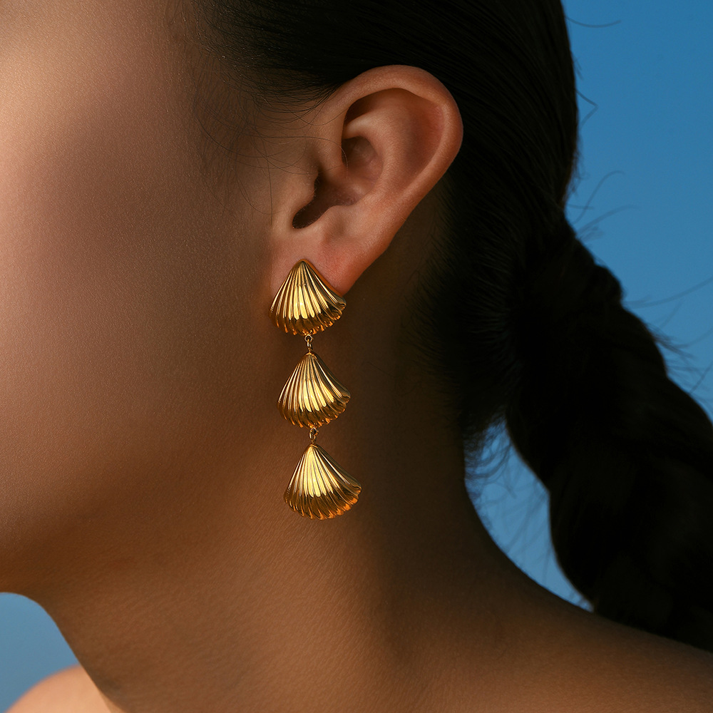 TENA europa y americana de acero inoxidable exagerado pendientes de nicho de alto nivel de diseño de conchas de mar de viento de titanio pendientes de acero joyas de orejas
