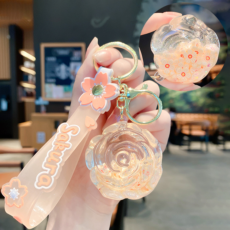 Llavero de rosa de aceite creativo lindo líquido arenas movedizas colgantes pequeños bolsos accesorios pareja pequeños regalos al por mayor
