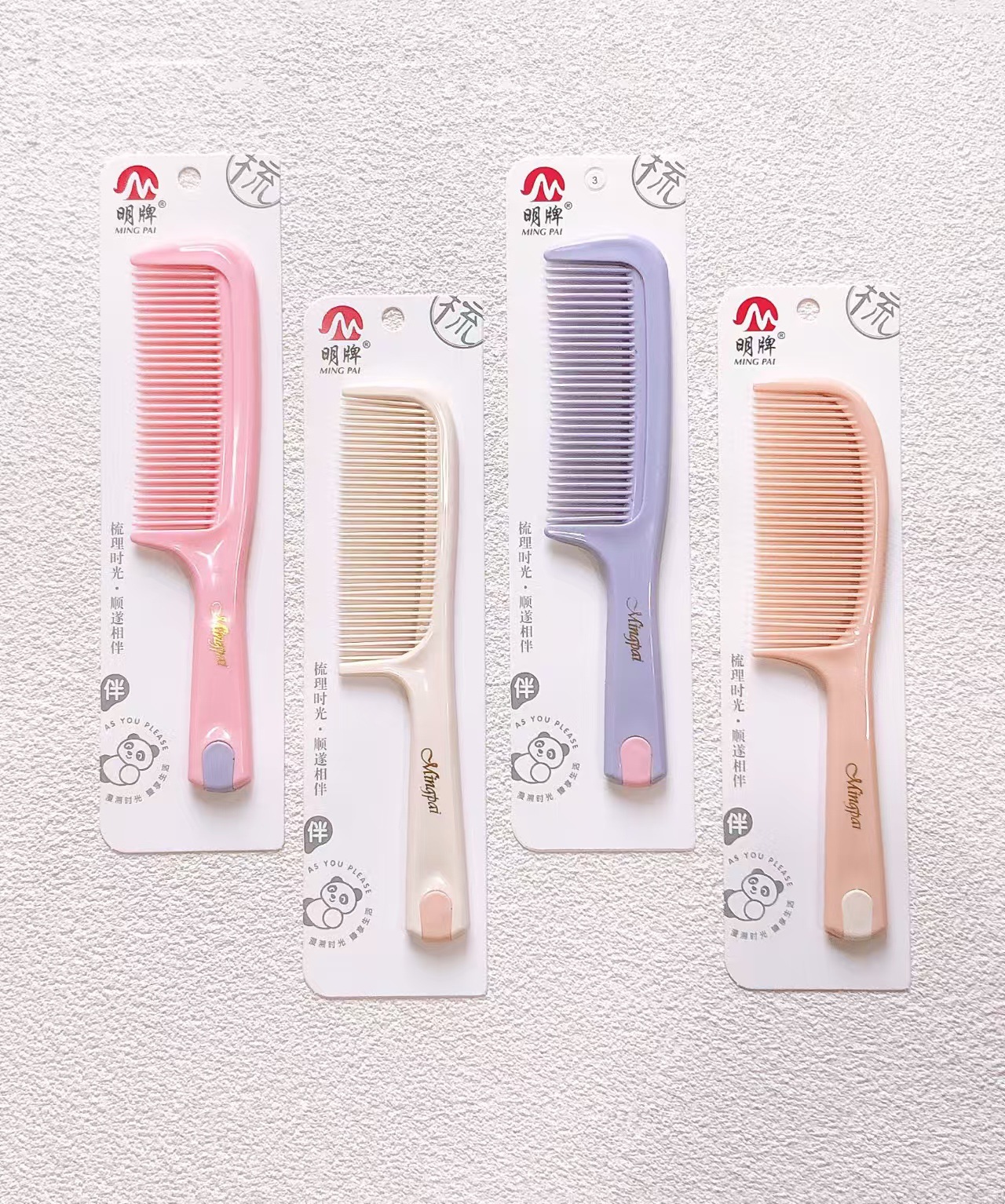 Nuevo paquete de impresión de cuerda de colgante independiente de trigo rollo de peinado de plástico peinado de belleza tienda de dos yuanes asequible