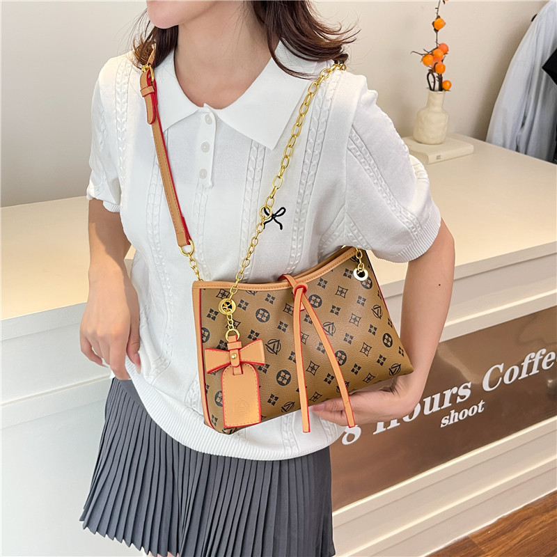 Bolso de cadena de textura transfronteriza 2025 verano nuevo bolso femenino retro bowknot bandolera moda contraste color bandolera