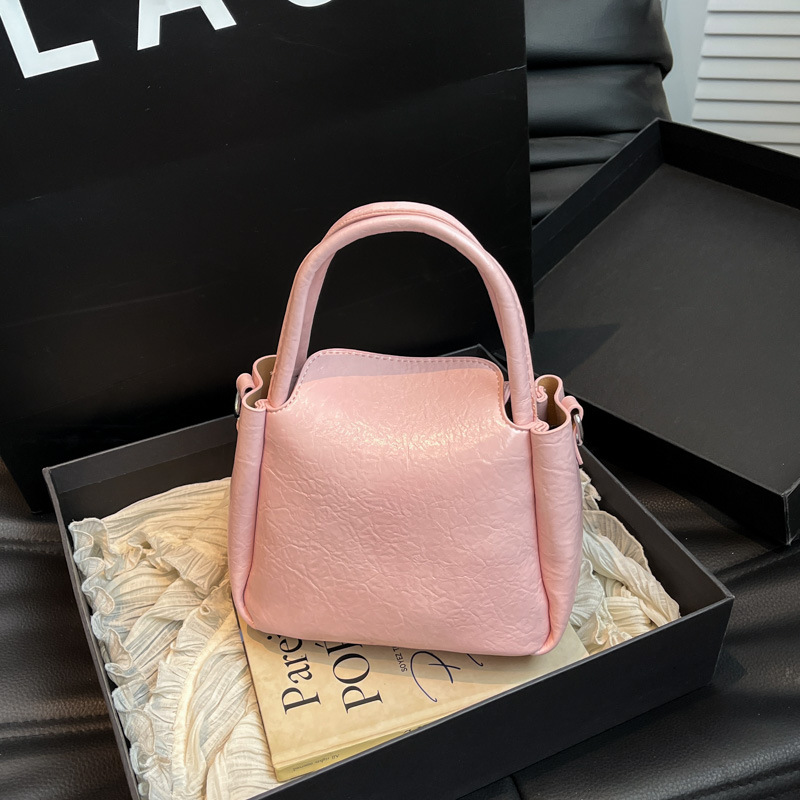 Bolso de alta calidad con textura 2025 verano nuevo estilo bolso femenino bolso de hombro con patrón de agarre fresco bolso de mensajero simple y versátil