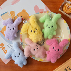 赤い本の爆発的なハニーピンクのウサギのキーホルダーはかわいい甘いぬいぐるみの学生のかばんのストラップのプレゼント飾りです
