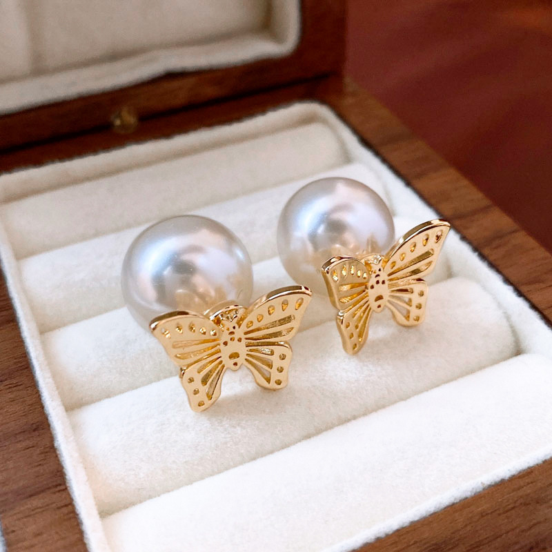 Pendientes de amor de perlas de lujo ligero con aguja de plata Pendientes de sentido de alta gama de temperamento de nicho Pendientes de estilo de palacio de todo fósforo de moda al por mayor