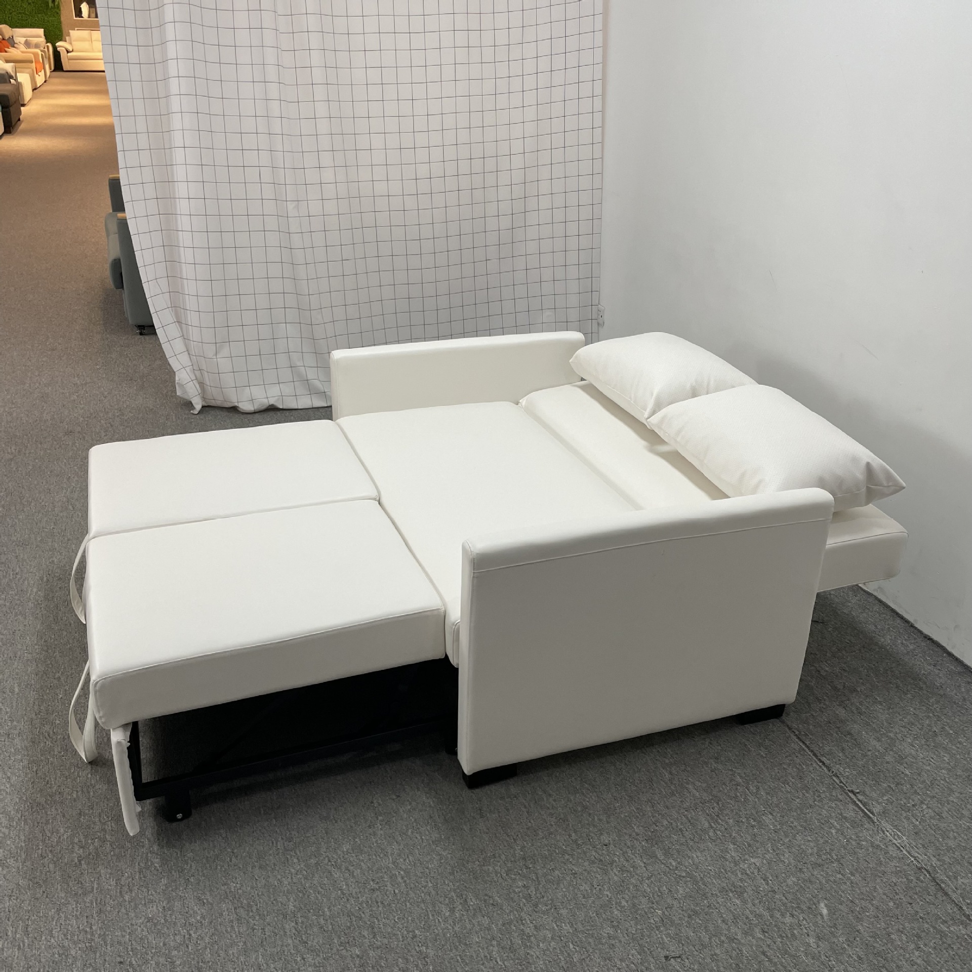 Sofá cama de cuero multifuncional, moderno y simple sofá de estilo de viento en la sala de estar.