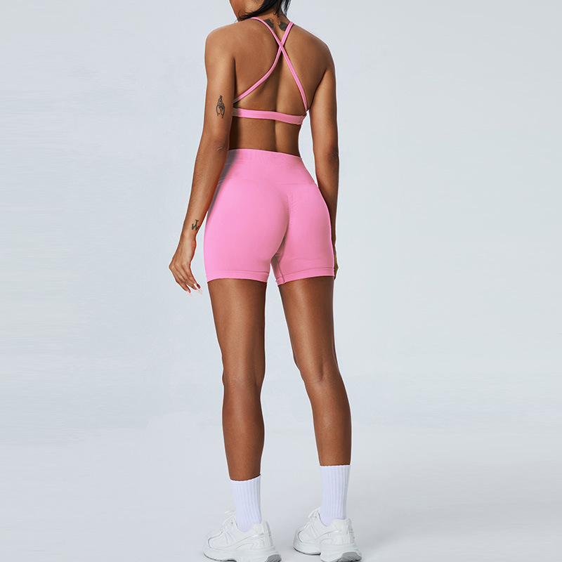 Nuevo traje de yoga sin costuras europeo y americano, pantalones cortos de yoga de cadera de melocotón para mujer, traje deportivo de carrera de espalda cruzada