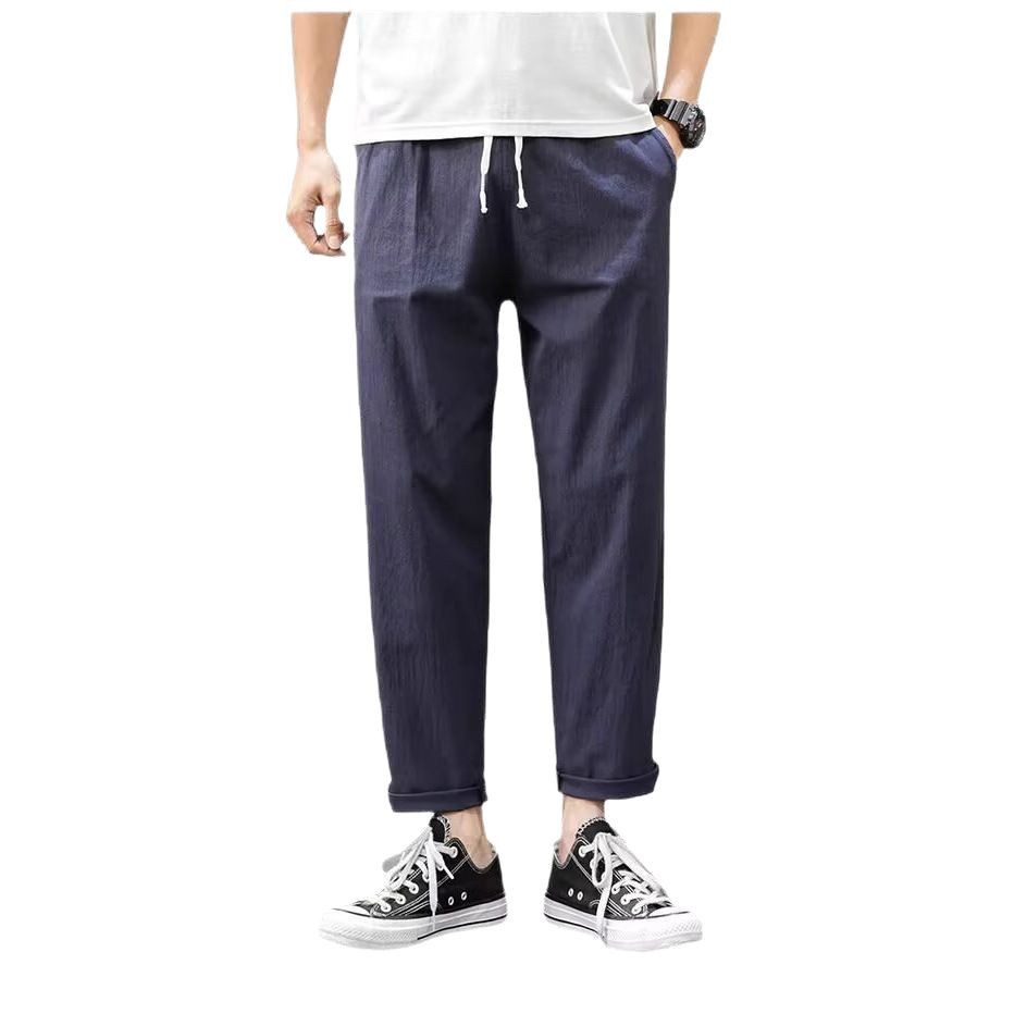 Pantalones casuales para niños otoño nueva marca de moda ropa de trabajo recta suelta nueve puntos pantalones largos deportivos 2025 primavera y otoño ropa de hombre