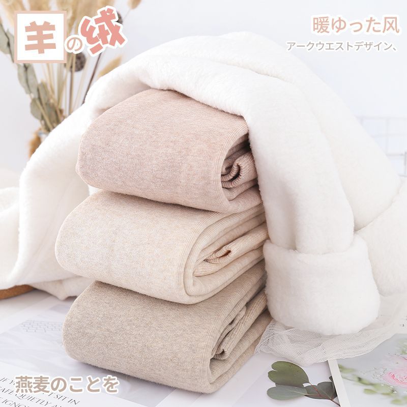 カシミヤの底のズボンの女性のベルベットの厚いズボンの靴下の春秋冬の系のオート麦の白い薄い色の縦の紋様の保温のズボンはやせています。