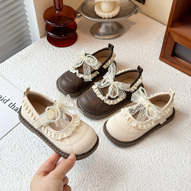 Zapatos de arco de encaje de niñas 2026 verano nuevo estilo de moda infantil zapatos de princesa universal zapatos Lefour huecos