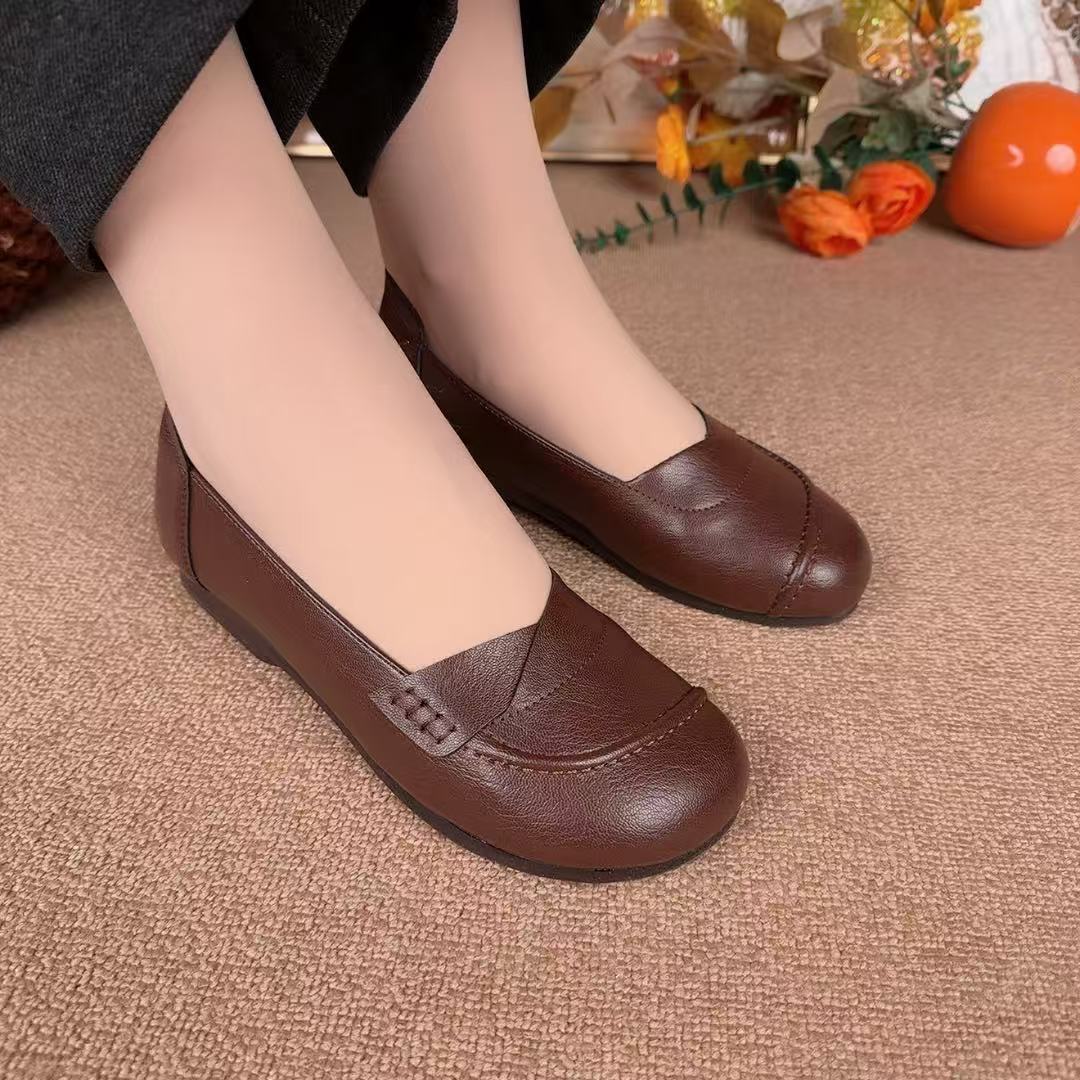 2026 primavera y verano nuevo estilo de moda versátil boca superficial cabeza redonda perezosa un pedazo de zapatos de madres de moda para mujeres