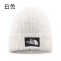 B white knitted hat