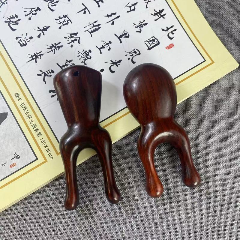 サイの角の紫檀木の鼻はマッサージ器の顔のツボの経絡を剃ります。|undefined