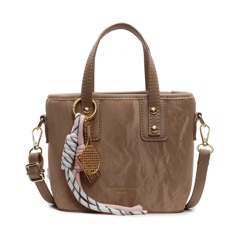 Comercio exterior explosión bolso de cubo de mano mujer 2025 nuevo simple bolso de hombro casual red explosión bolso de mochila coreano