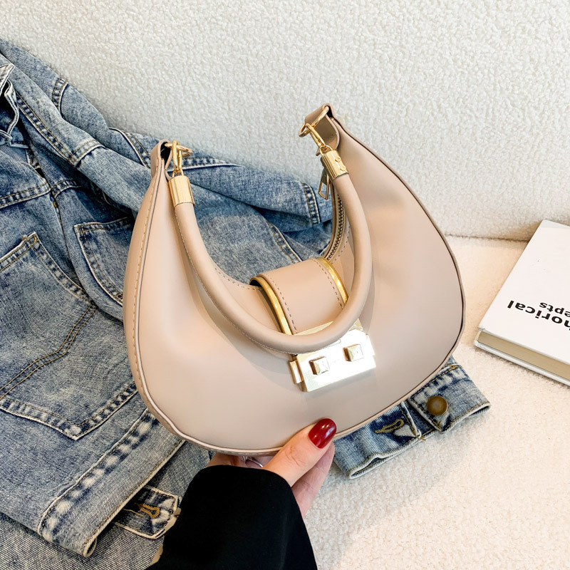 Bolso de axila simple y moderno 2024 nuevo diseño de nicho, estilo explosivo transfronterizo, bolso de luna nueva de un solo hombro de todo fósforo